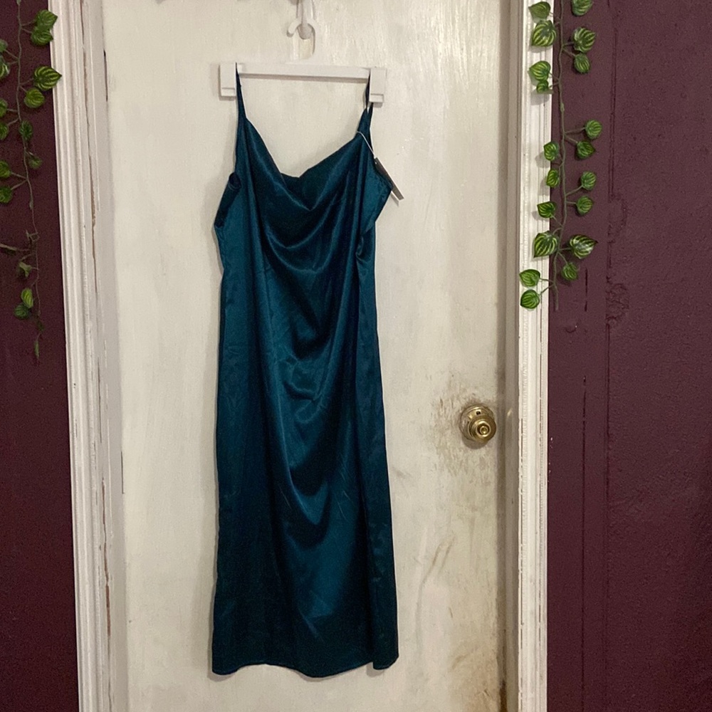 A shiny teal midi dress